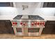 High-end stainless steel range with red knobs at 4118 Isle Vista Ave, Belle Isle, FL 32812