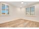 Bright bedroom with hardwood floors and plantation shutters at 4118 Isle Vista Ave, Belle Isle, FL 32812