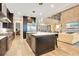Open concept kitchen with island and Gathering room view at 4118 Isle Vista Ave, Belle Isle, FL 32812