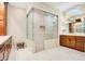 Elegant bathroom with a large walk-in shower and double vanity at 4118 Isle Vista Ave, Belle Isle, FL 32812
