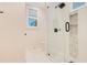 Contemporary bathroom with a walk-in shower and pebble tile at 4118 Isle Vista Ave, Belle Isle, FL 32812