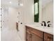 Elegant bathroom with double vanity, modern fixtures, and a walk-in shower at 4118 Isle Vista Ave, Belle Isle, FL 32812