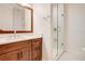 Clean bathroom with single vanity and a frameless shower at 4118 Isle Vista Ave, Belle Isle, FL 32812