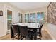 Bright dining area with large table and lake views at 4118 Isle Vista Ave, Belle Isle, FL 32812