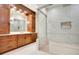 Elegant bathroom with a large walk-in shower and double vanity at 4118 Isle Vista Ave, Belle Isle, FL 32812