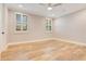 Spacious bedroom with hardwood floors and plantation shutters at 4118 Isle Vista Ave, Belle Isle, FL 32812