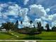 Two story house with lush landscaping and pond at 197 Valencia Ridge Dr, Auburndale, FL 33823