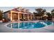 Resort-style pool with adjacent clubhouse at 197 Valencia Ridge Dr, Auburndale, FL 33823