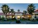 Community entrance with gated access and palm trees at 197 Valencia Ridge Dr, Auburndale, FL 33823
