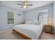 Light and airy bedroom with king bed and ceiling fan at 2923 Ridley Ave, Orlando, FL 32814