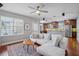 Bright living room featuring hardwood floors, a comfy sectional sofa and an open floor plan at 2923 Ridley Ave, Orlando, FL 32814