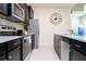 Modern kitchen with stainless steel appliances at 4458 Kaipo Rd, Davenport, FL 33897