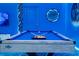 Pool table in a game room with blue walls and ocean-themed decor at 4458 Kaipo Rd, Davenport, FL 33897