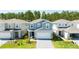 Community of two-story houses with gray and white exteriors at 4458 Kaipo Rd, Davenport, FL 33897