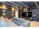Home theater with sectional sofa, large screen TV, and LED ceiling lights at 4458 Kaipo Rd, Davenport, FL 33897