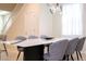 Elegant dining room with marble table and grey chairs at 4458 Kaipo Rd, Davenport, FL 33897
