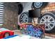 Race car themed bedroom with twin beds and mural at 4458 Kaipo Rd, Davenport, FL 33897