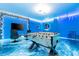 Game room with foosball table and ocean-themed decor at 4458 Kaipo Rd, Davenport, FL 33897