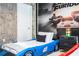 Themed bedroom with twin beds and Fast & Furious decor at 4458 Kaipo Rd, Davenport, FL 33897