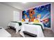 Two twin beds with Scooby-Doo themed wall art at 4458 Kaipo Rd, Davenport, FL 33897