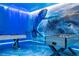 Game room with foosball table, pool table, and ocean-themed murals at 4458 Kaipo Rd, Davenport, FL 33897