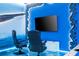 Gaming area with two comfortable chairs and a large TV at 4458 Kaipo Rd, Davenport, FL 33897