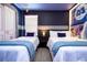 Bedroom with two twin beds, Monsters Inc. theme, and nightstand at 4458 Kaipo Rd, Davenport, FL 33897