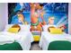 Two twin-size beds with Scooby-Doo themed wall art at 4458 Kaipo Rd, Davenport, FL 33897