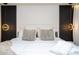 King-size bed in a well-lit bedroom with stylish pillows at 4458 Kaipo Rd, Davenport, FL 33897