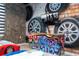 Race car themed bedroom with twin beds and mural at 4458 Kaipo Rd, Davenport, FL 33897