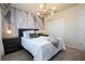 Spacious bedroom with a comfy bed and palm tree wall at 4458 Kaipo Rd, Davenport, FL 33897