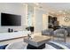 Open living area features a large TV and comfortable seating at 4458 Kaipo Rd, Davenport, FL 33897