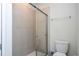 Clean bathroom with tiled shower and toilet at 4458 Kaipo Rd, Davenport, FL 33897