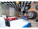 Race car themed bedroom with twin beds and mural at 4458 Kaipo Rd, Davenport, FL 33897