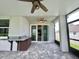 Covered patio with outdoor kitchen and paver stones at 2475 Hastings Blvd, Clermont, FL 34711