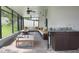 Screened patio with seating area and outdoor kitchen at 2475 Hastings Blvd, Clermont, FL 34711