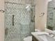 Modern bathroom with a herringbone tile shower at 2475 Hastings Blvd, Clermont, FL 34711