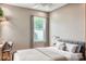 Bright bedroom with large window and comfortable bedding at 2475 Hastings Blvd, Clermont, FL 34711
