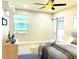 Bedroom with a queen bed, barn door, and a view of the backyard at 2475 Hastings Blvd, Clermont, FL 34711