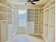 Spacious walk-in closet with ample shelving and hanging space at 2475 Hastings Blvd, Clermont, FL 34711