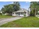 Cute bungalow with a gravel driveway at 1700 Minnesota Ave, St Cloud, FL 34769