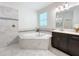 Elegant bathroom with corner soaking tub and walk-in shower at 1065 Blackwolf Run Rd, Davenport, FL 33896