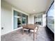 Screened patio with sliding glass doors, perfect for outdoor dining at 1065 Blackwolf Run Rd, Davenport, FL 33896