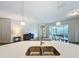 Kitchen island with double sink, quartz countertop, and breakfast bar seating at 1065 Blackwolf Run Rd, Davenport, FL 33896