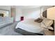 Main bedroom with large bed, dresser, and gray carpet at 1065 Blackwolf Run Rd, Davenport, FL 33896