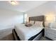 Spacious main bedroom with plush bed and gray carpet at 1065 Blackwolf Run Rd, Davenport, FL 33896