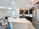 Modern kitchen with an island and stainless steel appliances at 1065 Blackwolf Run Rd, Davenport, FL 33896
