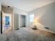 Bedroom with gray carpet, double-door closet, and window at 1065 Blackwolf Run Rd, Davenport, FL 33896