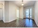 Light and airy entryway with wood-look tile floors at 1065 Blackwolf Run Rd, Davenport, FL 33896