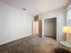 Bedroom with gray carpet, double-door closet, and window at 1065 Blackwolf Run Rd, Davenport, FL 33896